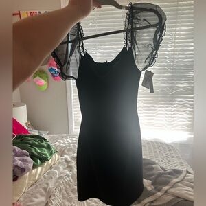 Brand new black dress. Fits like a medium large. Size 11.